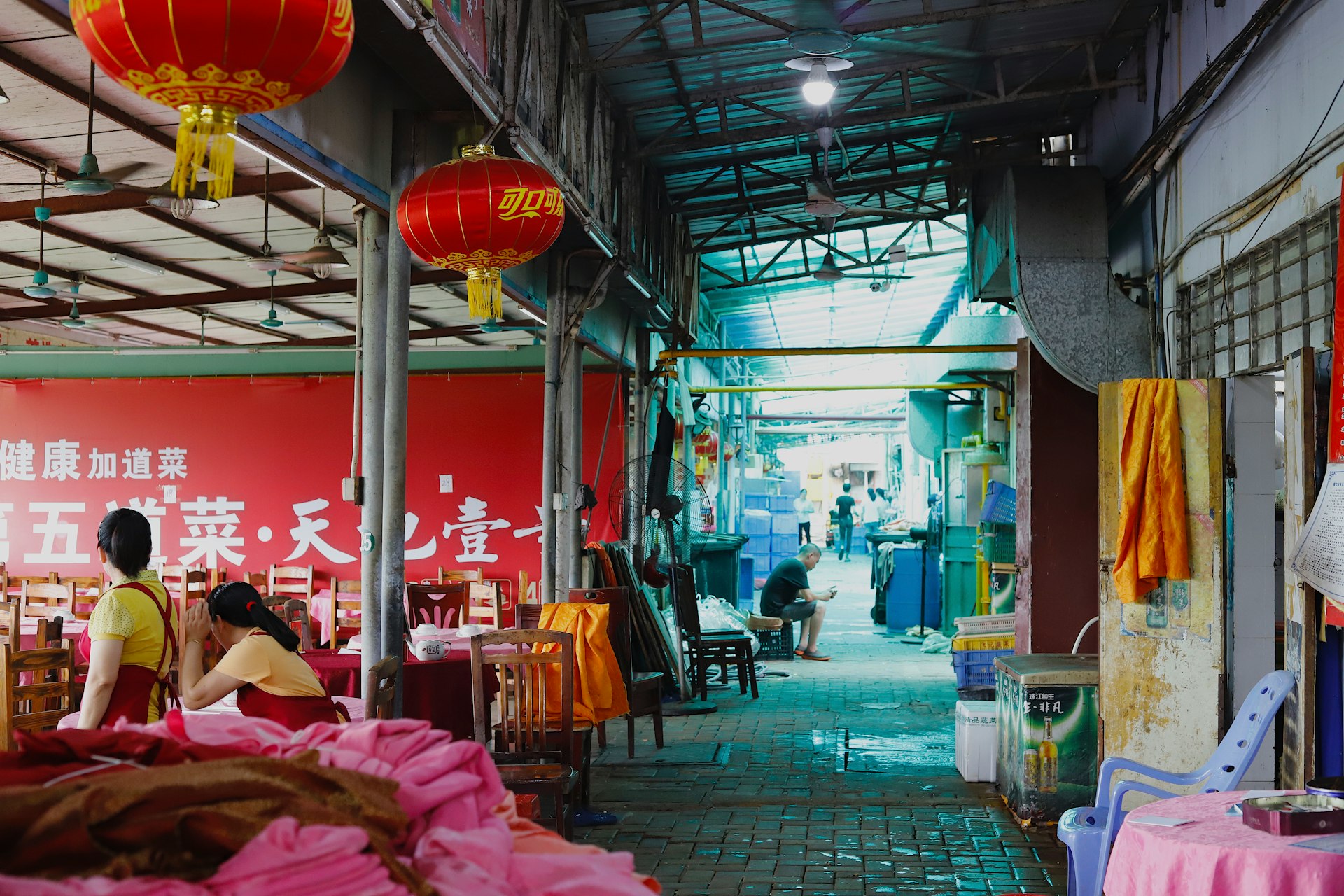 two red Chinese lanterns hanging on ceiling